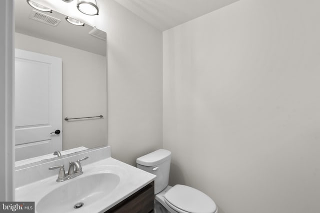 14628 Old Hanover Rd Regi, Unit Regi, Reisterstown, MD 21136 - half bath with toilet, visible vents, and vanity