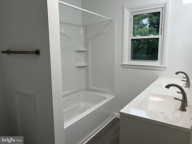 bathroom featuring vanity and shower / bath combination