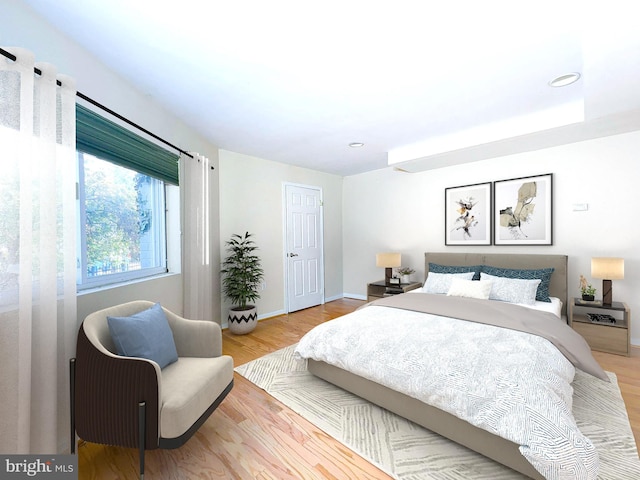 bedroom with hardwood / wood-style flooring