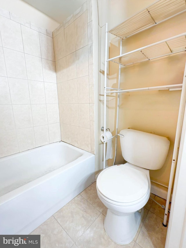 bathroom featuring tile patterned flooring and toilet