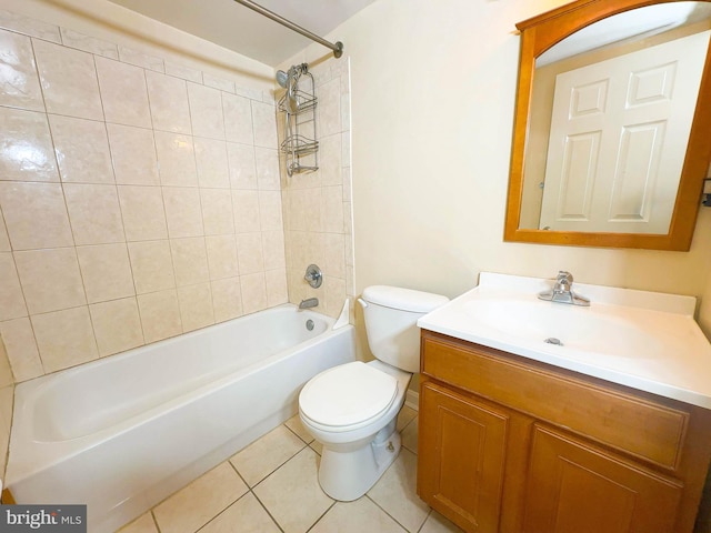 full bathroom with vanity, tile patterned flooring, toilet, and tiled shower / bath