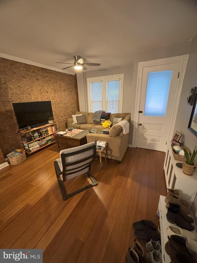 living room featuring ceiling fan and hardwood / wood-style floors