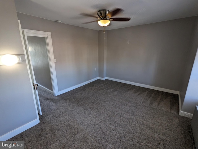 carpeted empty room with ceiling fan