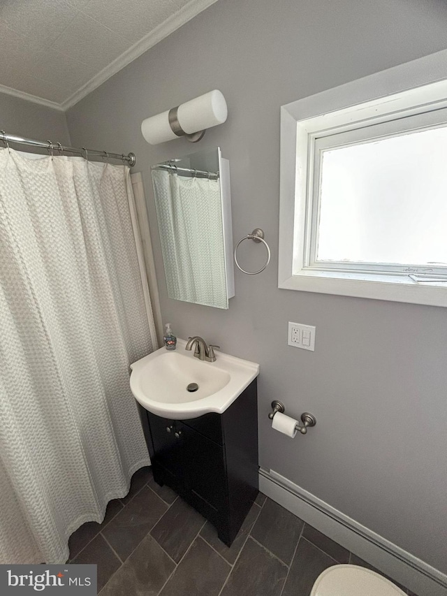 bathroom featuring a shower with curtain, vanity, toilet, and ornamental molding