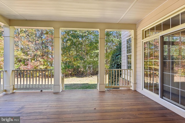 unfurnished sunroom featuring a wealth of natural light