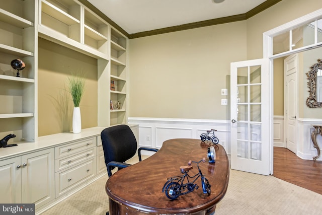 office with french doors, crown molding, and light hardwood / wood-style floors