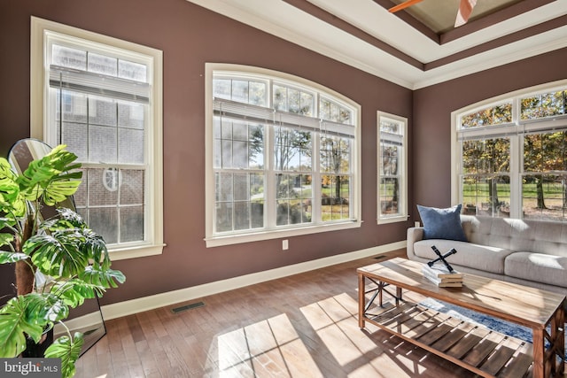 sunroom / solarium featuring ceiling fan