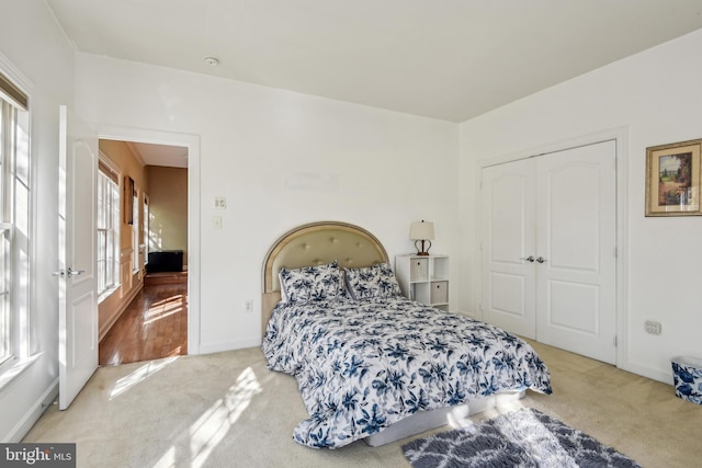 carpeted bedroom featuring a closet