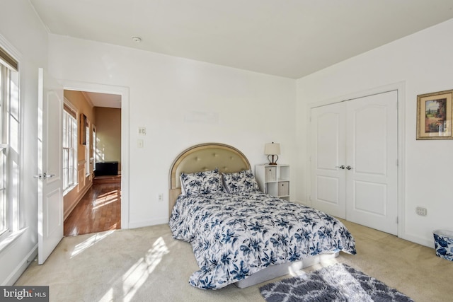 708 Church Rd S, Upper Marlboro, MD 20774 - bedroom with carpet floors, a closet, and multiple windows