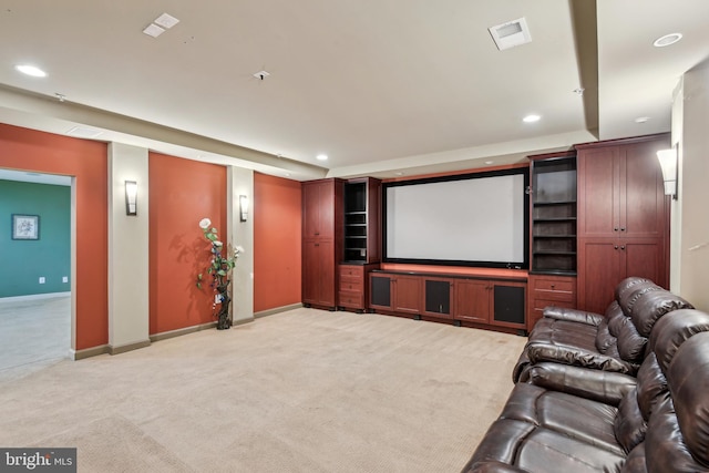 home theater featuring light colored carpet