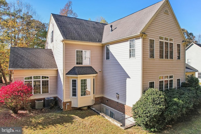 708 Church Rd S, Upper Marlboro, MD 20774 - back of house featuring central AC unit and a shingled roof