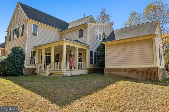 view of front facade with a porch and a front lawn