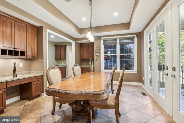 708 Church Rd S, Upper Marlboro, MD 20774 - dining space with light tile patterned floors, a healthy amount of sunlight, and a tray ceiling