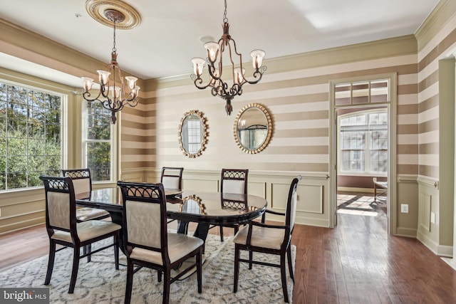 708 Church Rd S, Upper Marlboro, MD 20774 - dining space with a wainscoted wall, ornamental molding, a chandelier, wood-type flooring, and wallpapered walls