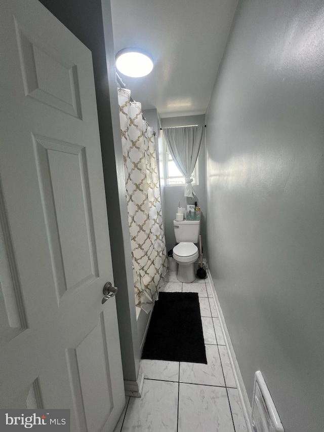 bathroom with toilet and shower / bathtub combination with curtain