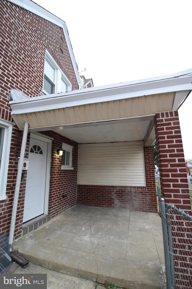 exterior space featuring a carport