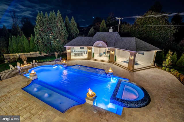 view of swimming pool featuring an in ground hot tub and a patio area