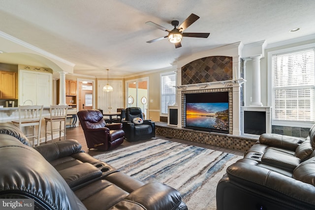 living room with wood-type flooring and ornamental molding