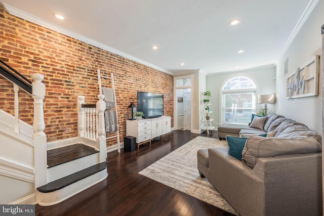 living room featuring crown molding, brick wall, and dark hardwood / wood-style flooring