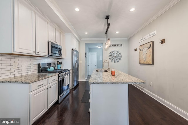 kitchen featuring white cabinetry, stainless steel appliances, dark wood-type flooring, and decorative light fixtures