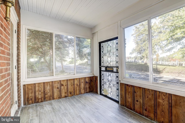 unfurnished sunroom featuring a healthy amount of sunlight