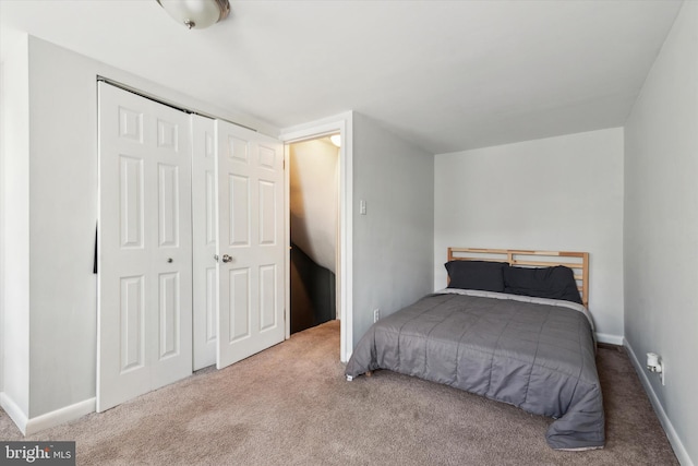 bedroom featuring a closet and carpet