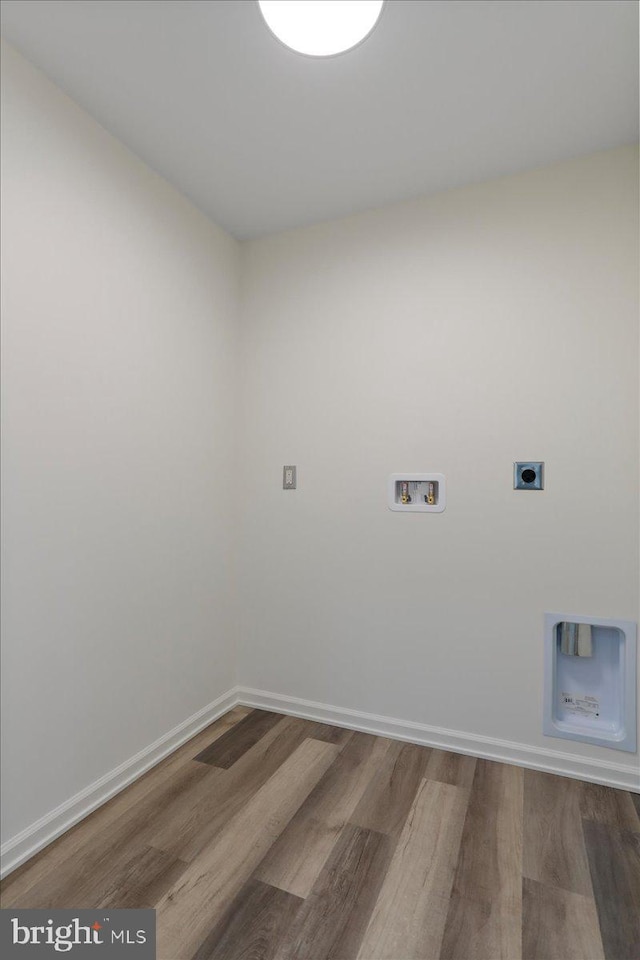 laundry room featuring hookup for a washing machine, electric dryer hookup, and wood-type flooring