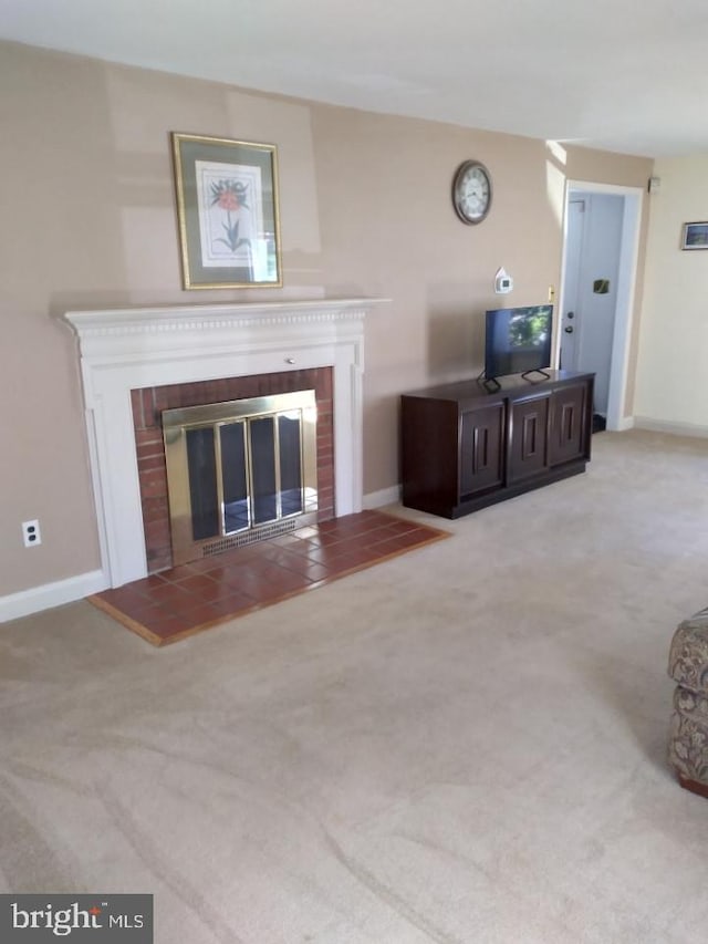 carpeted living room featuring a fireplace