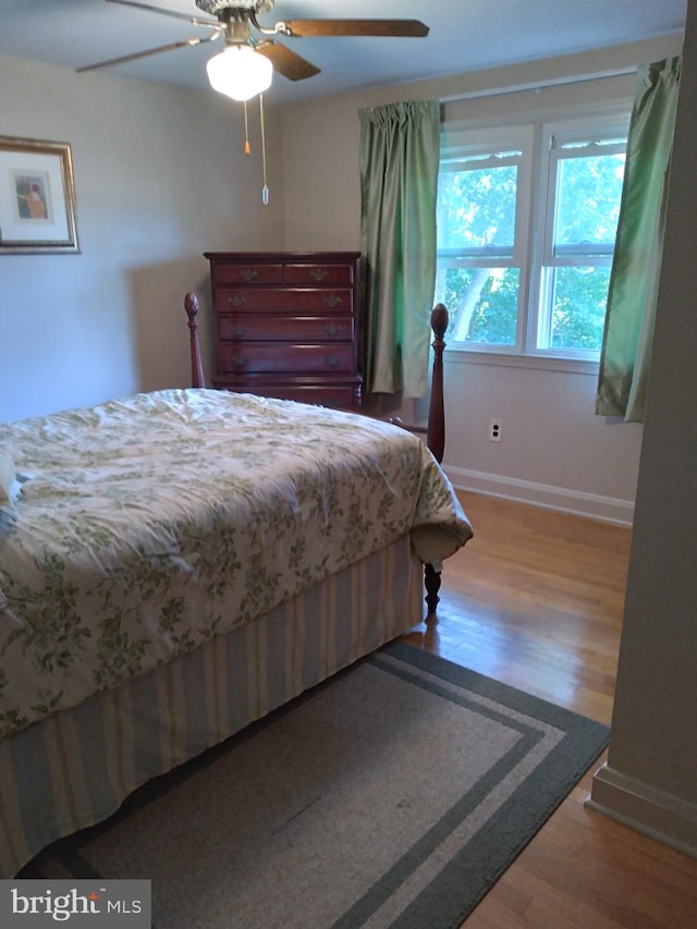 bedroom featuring ceiling fan and wood-type flooring