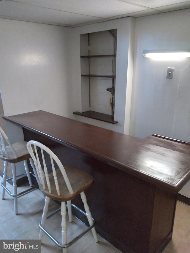 office area featuring a paneled ceiling