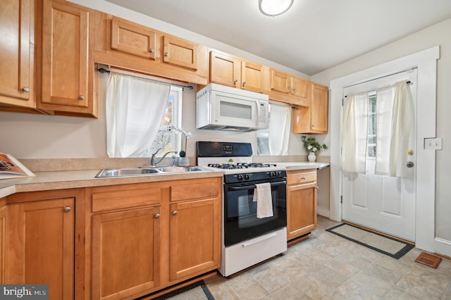 kitchen with white appliances and sink