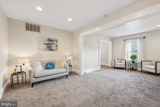 sitting room with carpet flooring