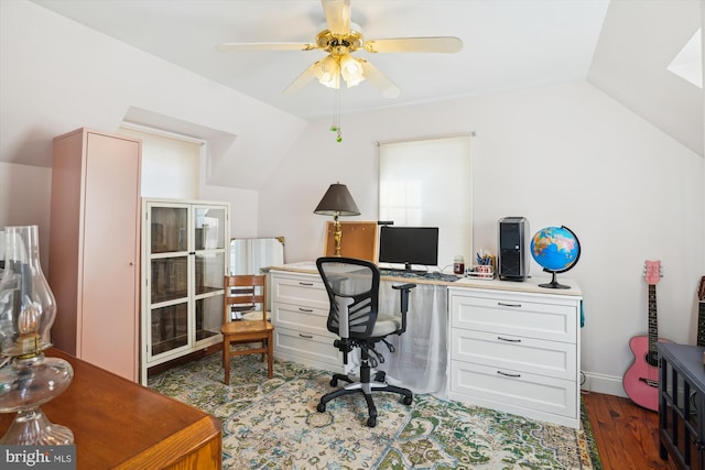 home office with dark hardwood / wood-style flooring, ceiling fan, and lofted ceiling