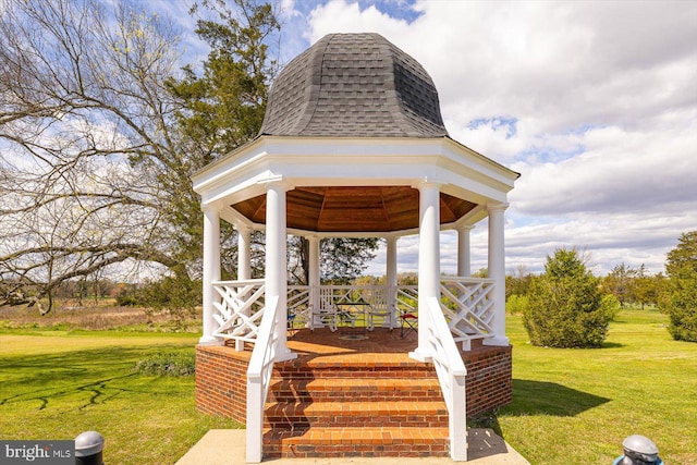 view of property's community featuring a gazebo and a lawn