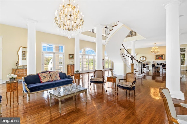 interior space featuring french doors, hardwood / wood-style floors, and ornate columns