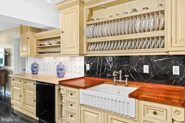 kitchen featuring decorative backsplash, wine cooler, and wooden counters