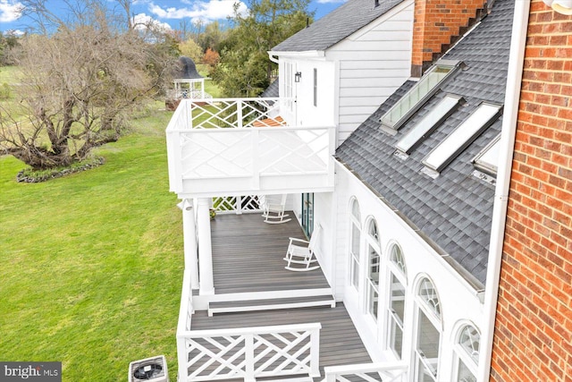 wooden deck with a yard