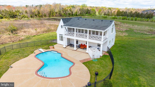 view of pool featuring a patio and a lawn