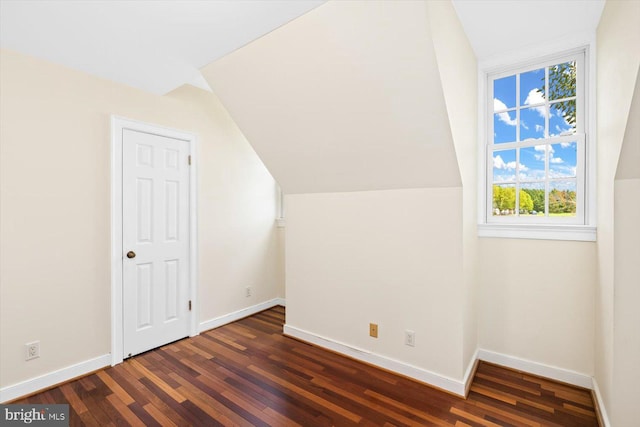 bonus room featuring lofted ceiling and dark hardwood / wood-style floors