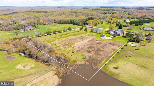 birds eye view of property featuring a water view and a rural view