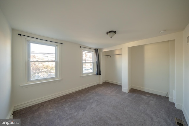 unfurnished bedroom with carpet flooring and a closet