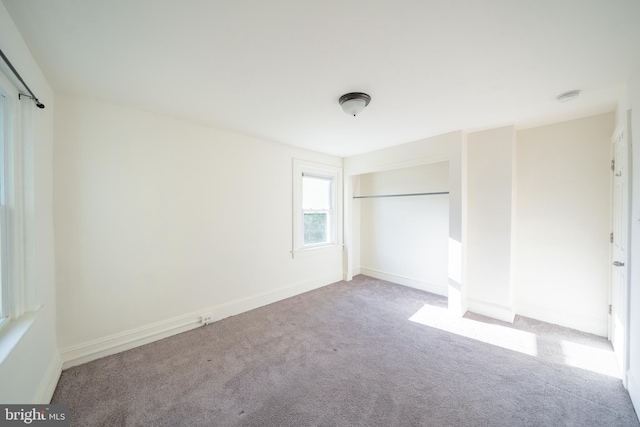 unfurnished bedroom with light carpet