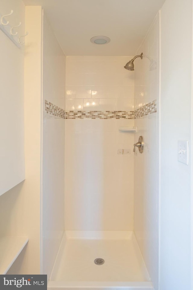 bathroom with tiled shower