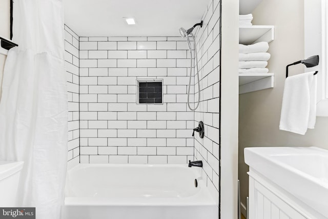 bathroom featuring vanity and shower / bath combo