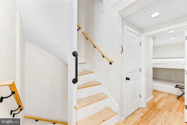 stairway with wood-type flooring