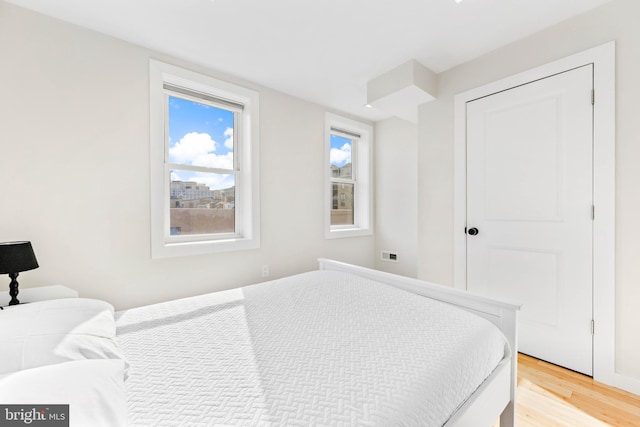 bedroom with light hardwood / wood-style flooring