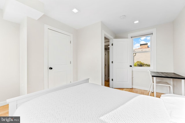 bedroom with wood-type flooring