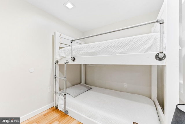 bedroom with wood-type flooring