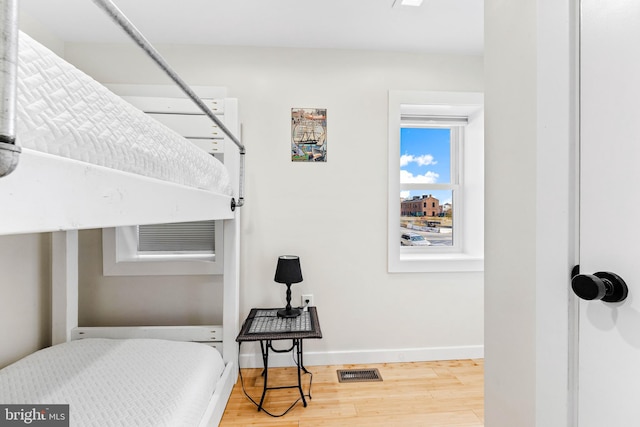 bedroom featuring wood-type flooring