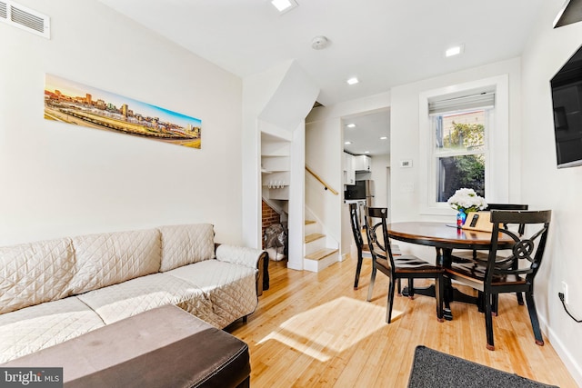 dining area with wood-type flooring